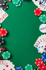 Flat lay poker table background with cards, chips, dice on green felt. Casino gambling concept with copy space for text. © photoguns
