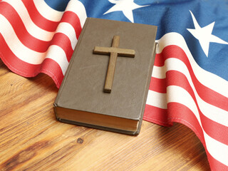 Holy Bible, Christian cross and US flag. Indoor. God Bless America.