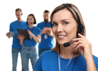 Technical support call center. Smiling operator on white background, selective focus