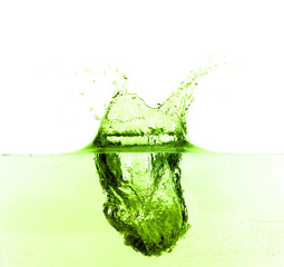 Beautiful green water splashing against white background
