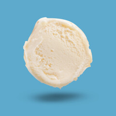 Ice cream scoop in air on light blue background. Yummy dessert