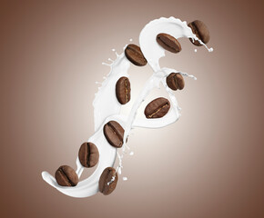 Aromatic coffee beans and splashes of fresh milk in air on light brown background