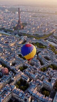 Colorful Hot Air Balloon Soaring Over Paris Skyline  