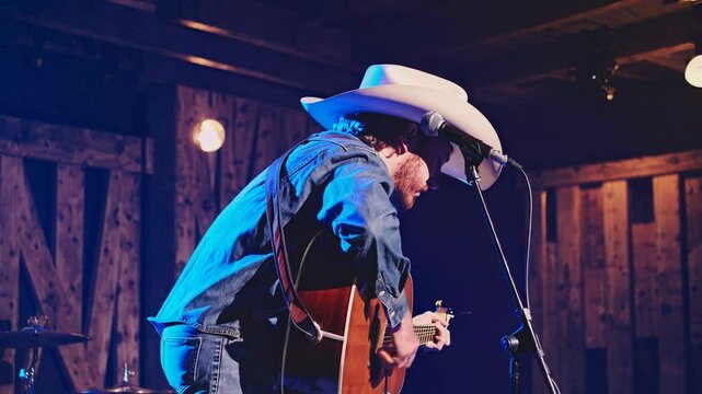 Country Musician Performing Emotionally on Stage with Lighting  