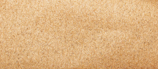 Textured Grainy Brown Paper Background with Natural Rough Surface