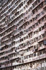 Dense residential building showing many air conditioners in hong kong