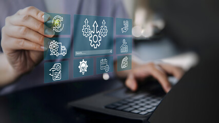 A business person using laptop with visual screen increase productivity concept.