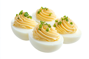 three deviled eggs with a sprig of green on top