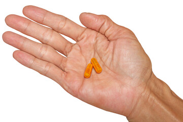 Hand Holding Orange Capsule Pill on Transparent Background