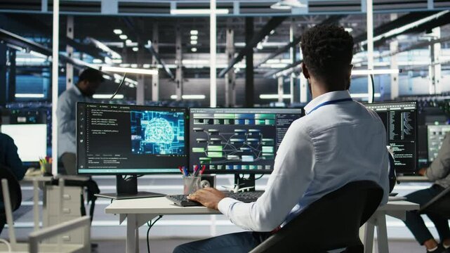 Data center programmer uses machine learning node tree program to identify equipment issues. Server hub worker reviewing artificial intelligence data analysis graph to minimize failures, camera A