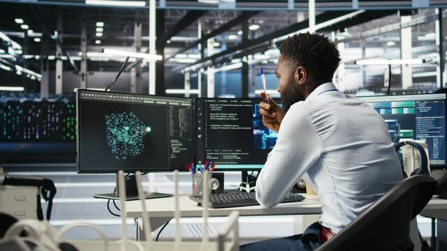 Data center programmer uses neural networks node tree program to identify equipment issues. Server hub employee reviewing AI deep learning data analysis graph to minimize failures, camera A