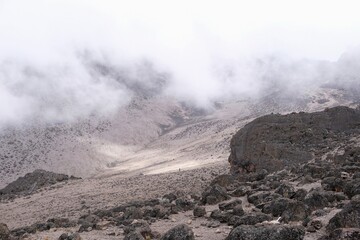Little single person on trail from Barranco Hut to Barafu Camp, during trekking to Kilimanjaro Peak,  Machame Route, Tanzania