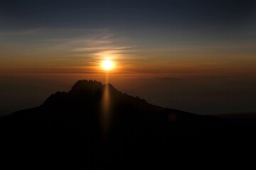 Sunset scenery with Mawenzi Peak on horizon during climbing to Uhuru peak on Kibo volcano (Kilimanjaro) – 5895 m. Tanzania