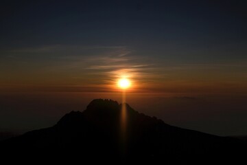 Sunset scenery with Mawenzi Peak on horizon during climbing to Uhuru peak on Kibo volcano (Kilimanjaro) – 5895 m. Tanzania