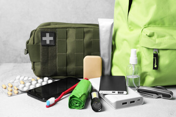 Survival kit. Different emergency supplies on light table