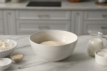 Making pretzels. Dough and ingredients on table in kitchen