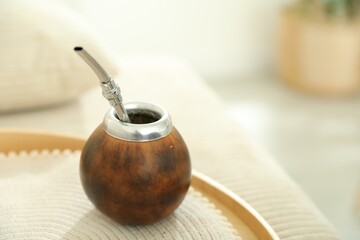 Traditional yerba mate tea on table indoors