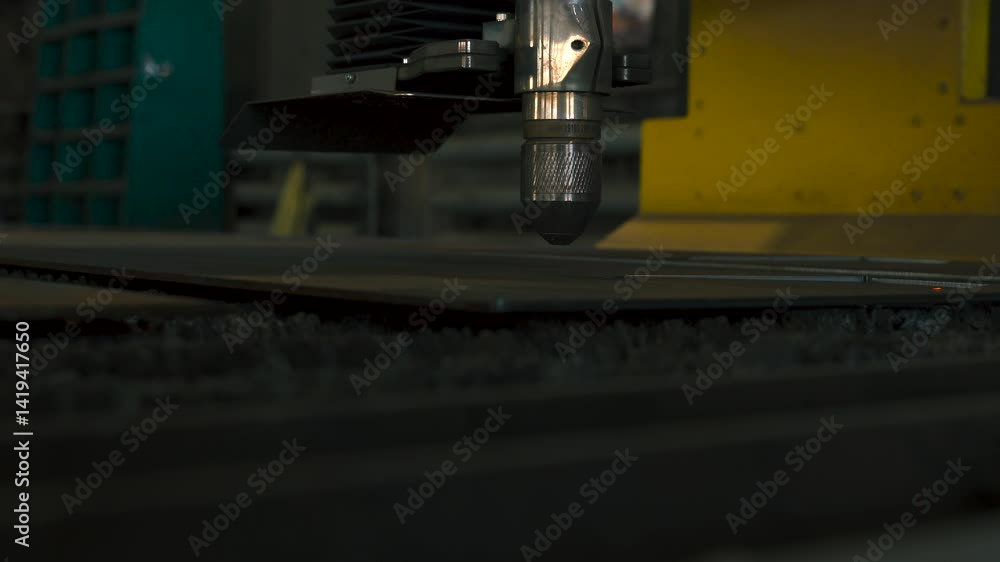 Poster witness the intricate process of metal part fabrication as a laser cutting machine expertly shapes s