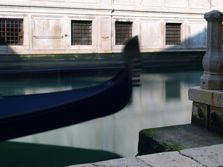 Long exposure photo of Gondola moored in canal. Detail. Venice, Italy.