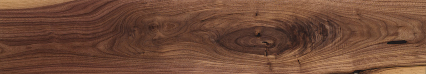 Black walnut wood texture of long solid board untreated