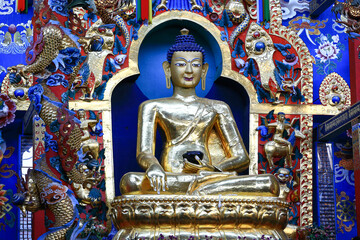 Image of golden buddhist statue in buddhist temple.