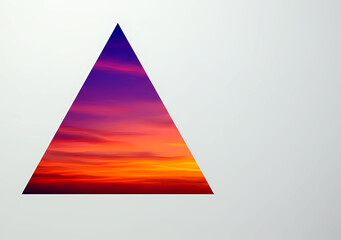 Obraz premium A triangle-shaped hole in a white wall, showing a vibrant sunset through 