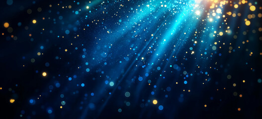 Bright blue and gold particles create mesmerizing abstract background, with soft rays of light illuminating scene, evoking sense of wonder and tranquility