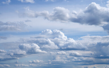 Fluffy White Clouds in a Blue Sky Natural Background for Travel, Atmosphere and Weather Related Themes