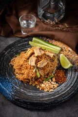 A plate of food with a glass of water on the table