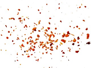 Dried red chili powder flying. Grainy scatterings of spicy burst . Splashes of red pepper powder.Overlay effect chilli or paprika spice splatters.