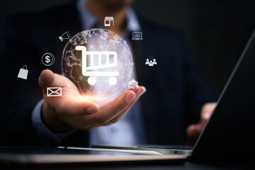 Businessperson holding a glowing globe with various e-commerce symbols like a shopping cart, house, and laptop. Ideal for representing global online shopping and digital transactions.