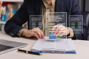 businessman stamping an approved document with a digital signature while reviewing legal documents...
