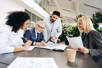 Business people working on sustainable project in modern office