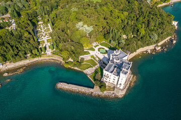 Aerial view of the Miramare Castle at the Adriatic sea coast in Italy