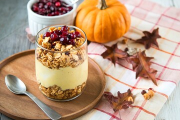 Thanksgiving breakfast with pumpkin granola parfait and cranberry sauce