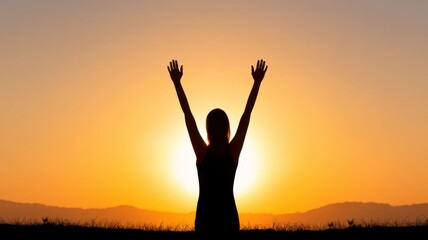 Fototapeta premium Mother's day gratitude cozy. A silhouette of a person with raised arms against a glowing sunset, symbolizing freedom and joy in a serene landscape.