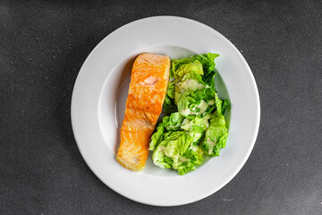 Salmon fried fish seafood dish fresh delicious gourmet food background on the table rustic food top view copy space keto paleo diet vegetarian food pescetarian diet