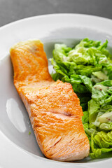 Salmon fried fish seafood dish fresh delicious gourmet food background on the table rustic food top view copy space keto paleo diet vegetarian food pescetarian diet