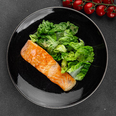 Salmon fried fish seafood dish fresh delicious gourmet food background on the table rustic food top view copy space keto paleo diet vegetarian food pescetarian diet