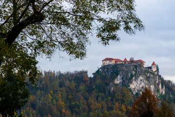 Lake Bled castle at the top of the hill in autumn. Fall season Slovenia