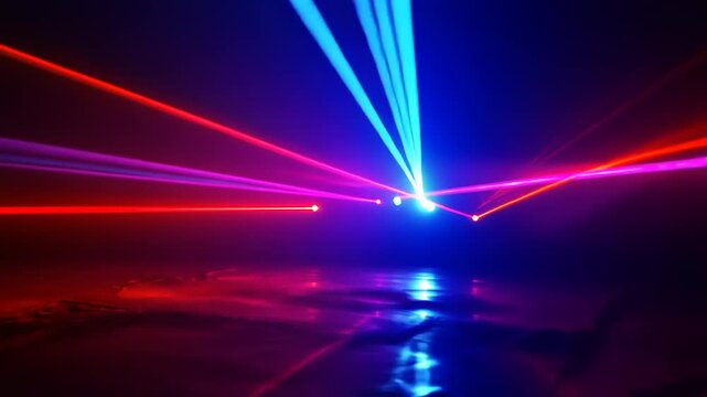Colorful laser beams illuminating a dark space, creating dynamic patterns and reflections