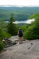 Naklejka premium Woman Looks back to Jordan Pond from the West Face Cadillac Trail