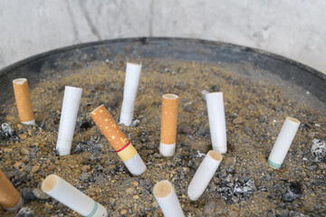 Cigarette in ashtray