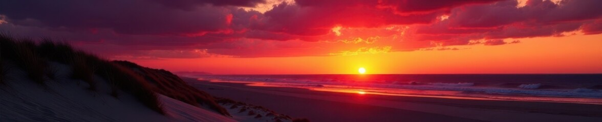 Obraz premium Dramatic sunset over Glenelg Beach; silhouetted dunes against fiery sky , shadow, red
