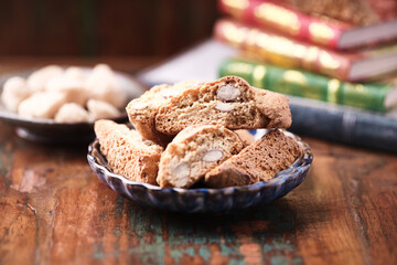 Cantuccini (Italian cookies) on dark wooden background. Close up	