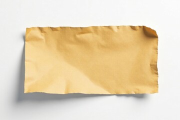 Fototapeta premium Crinkled brown cardboard piece, clean white backdrop , piece, eco-friendly