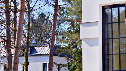 Luxury real estate single family house with white modern facade. A suburban district of single-family homes.