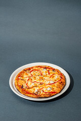 Tasty pizza on gray background, top view. Space for text