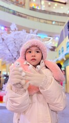 Cute little Girl wearing a sweater.