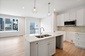 Kitchen with a white counter and a sink
